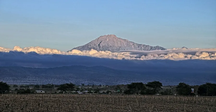 Mount Meru Day 2 — moorland and heath zone approaching Saddle Hut with Kilimanjaro visible