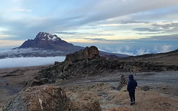 Final ascent to Uhuru Peak in pre-dawn darkness