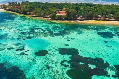 Zanzibar beach holiday after Kilimanjaro — recovery on white sand