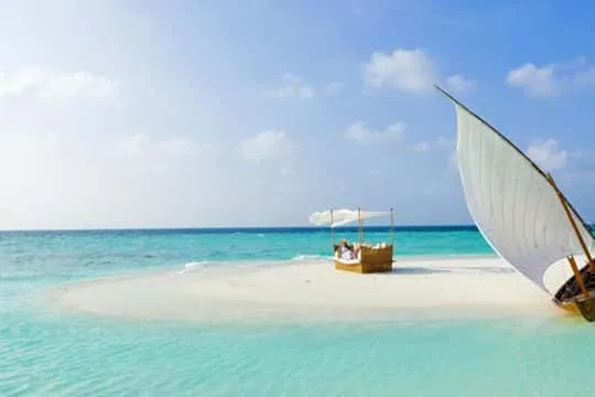 Jambiani village beach Zanzibar — local fishing boats and undeveloped shore
